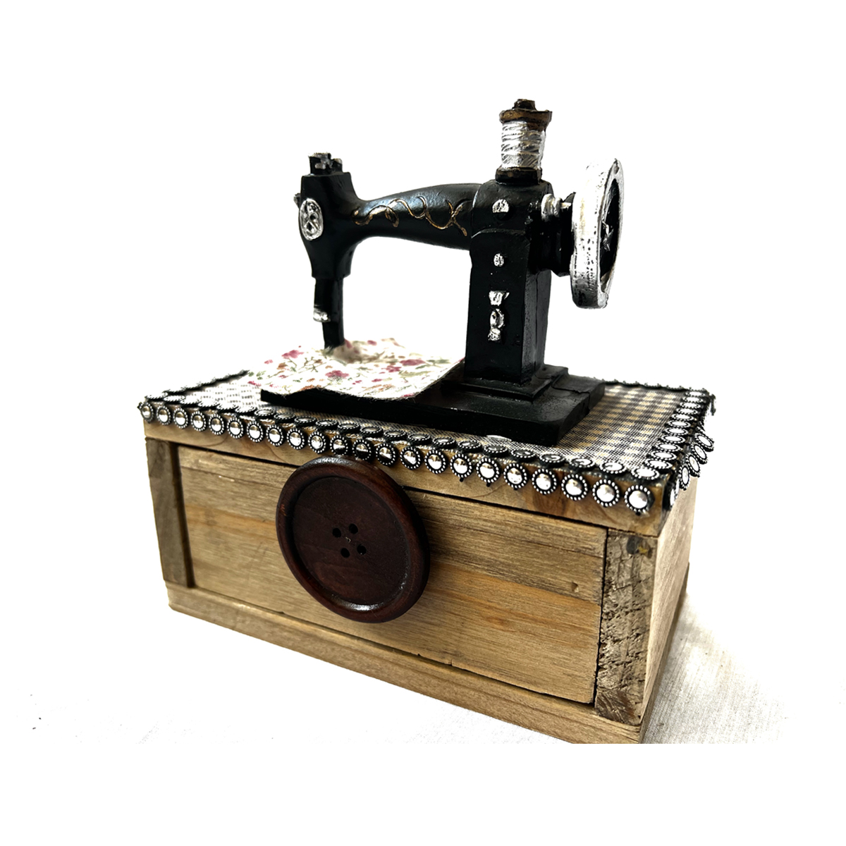 Caja musical de madera con máquina de coser