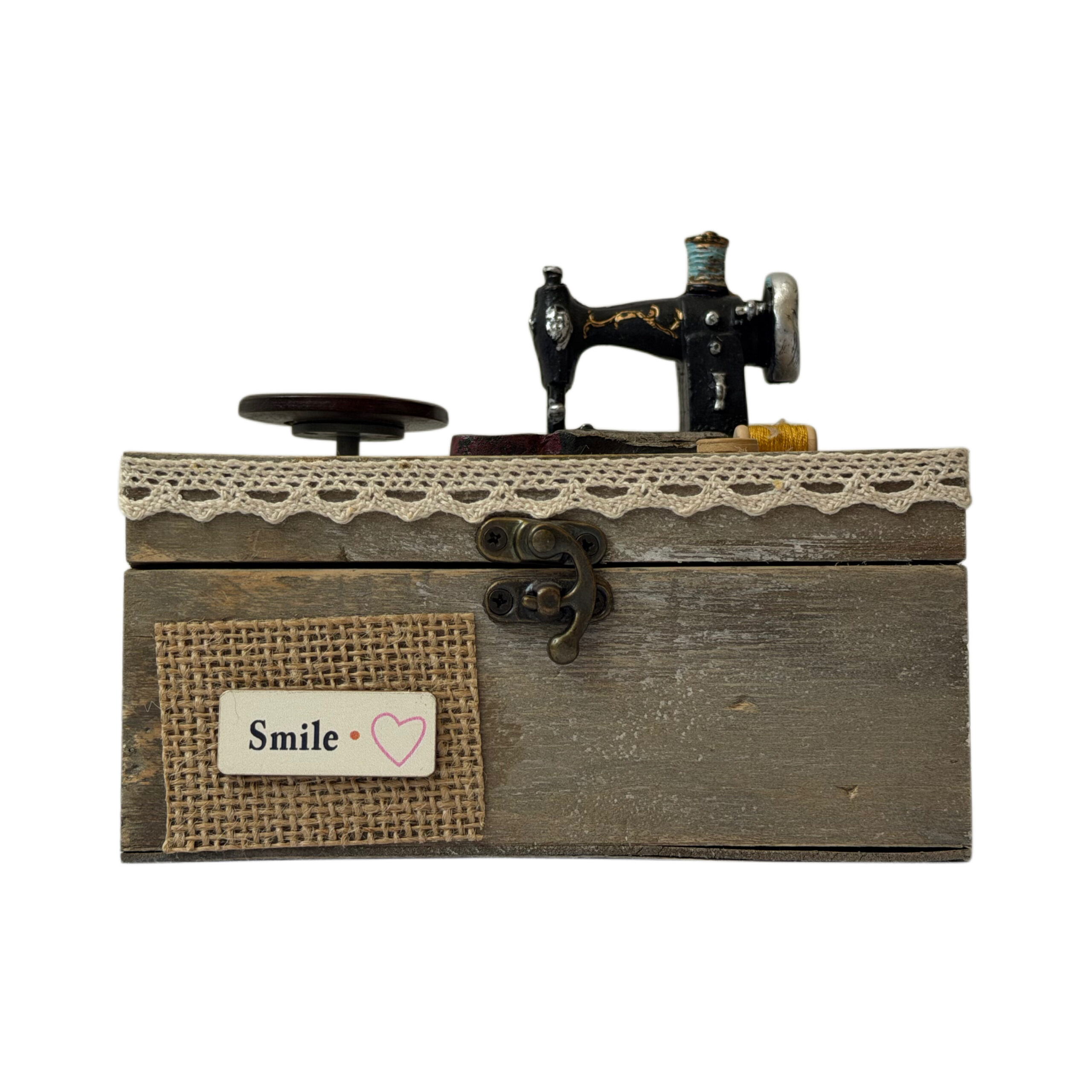 Caja musical de madera con máquina de coser