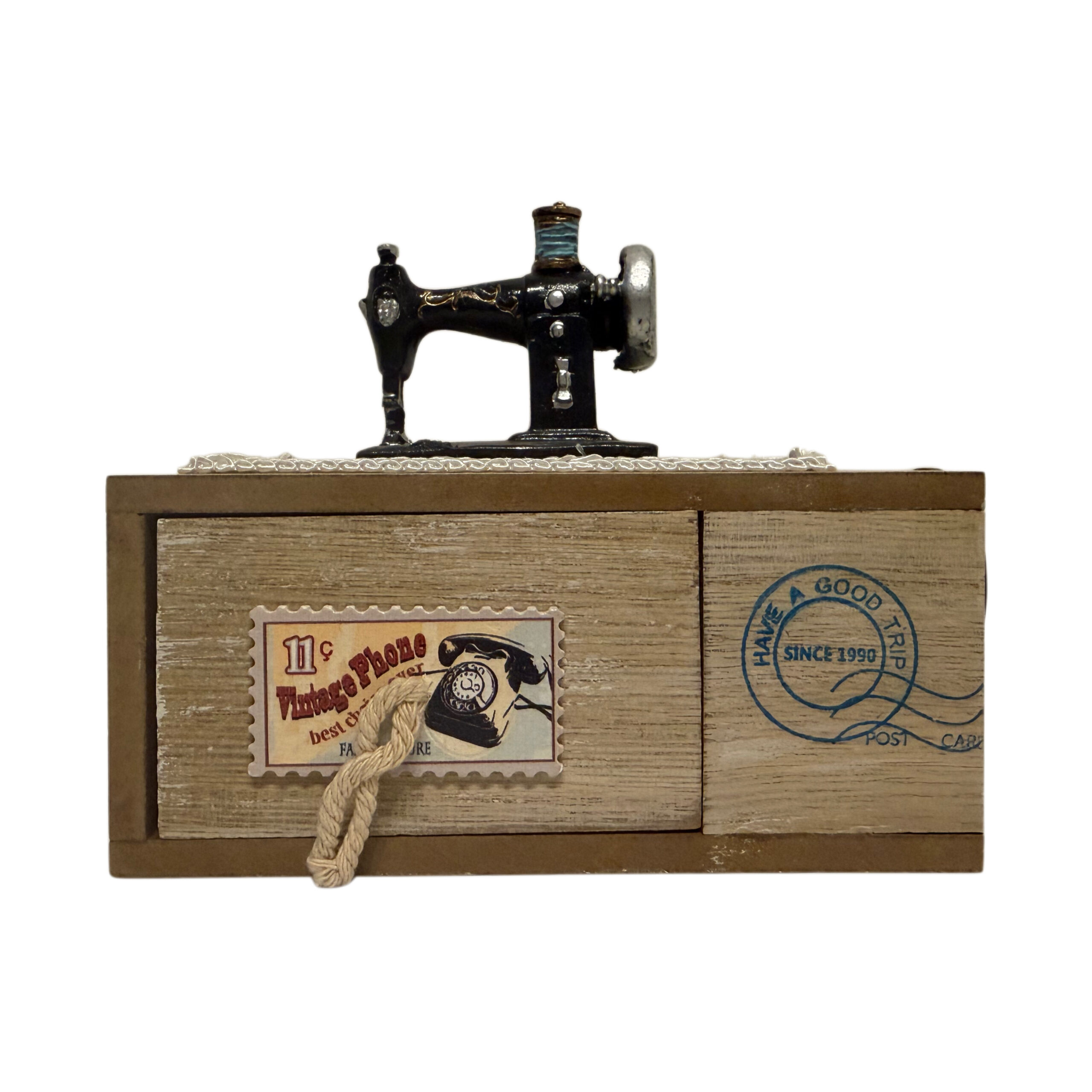 Caja musical de madera con máquina de coser