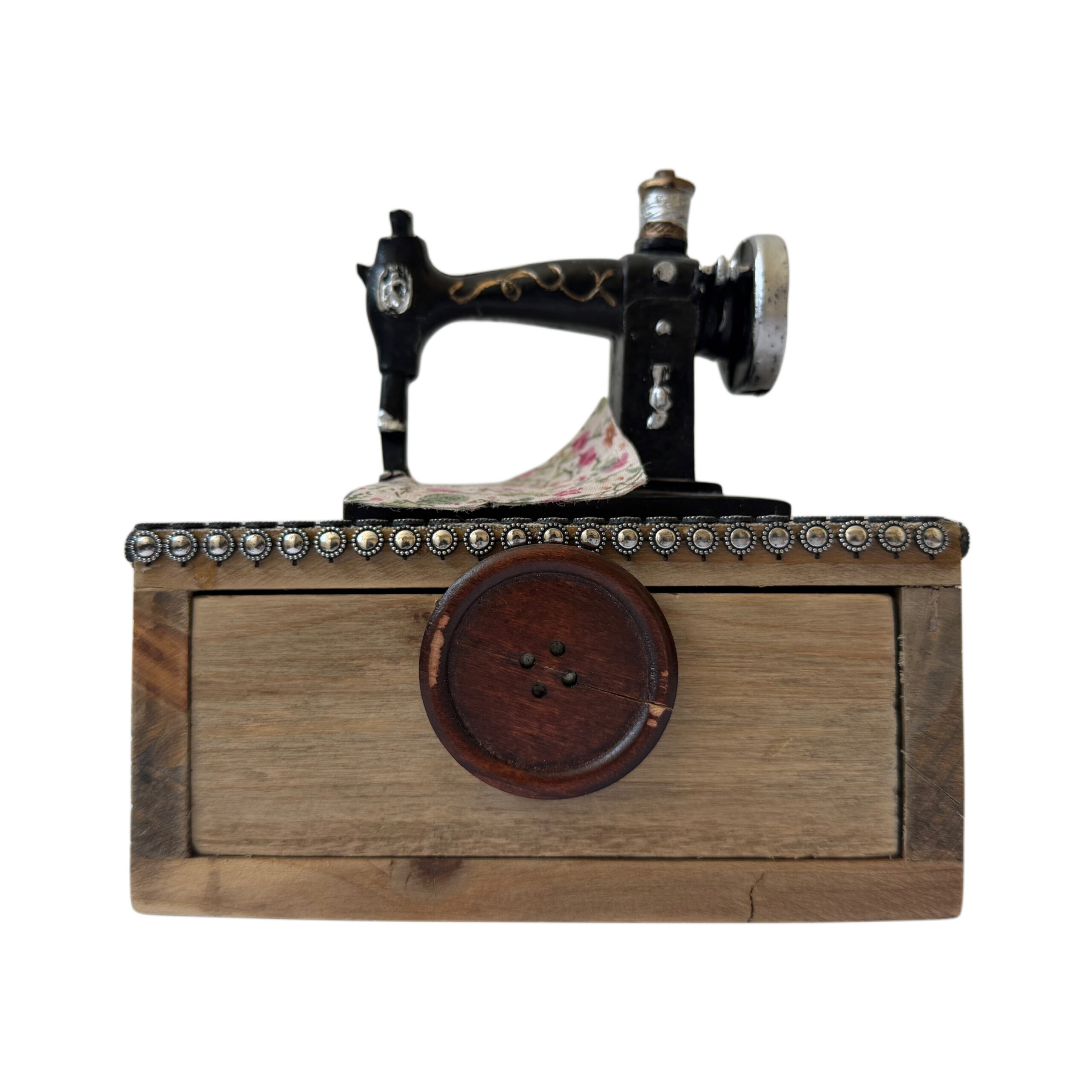 Caja musical de madera con máquina de coser